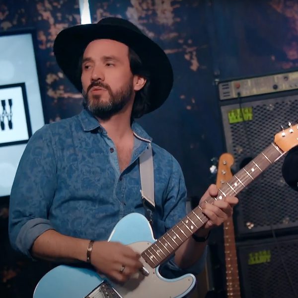 Portrait of Diego Neira playing the guitar